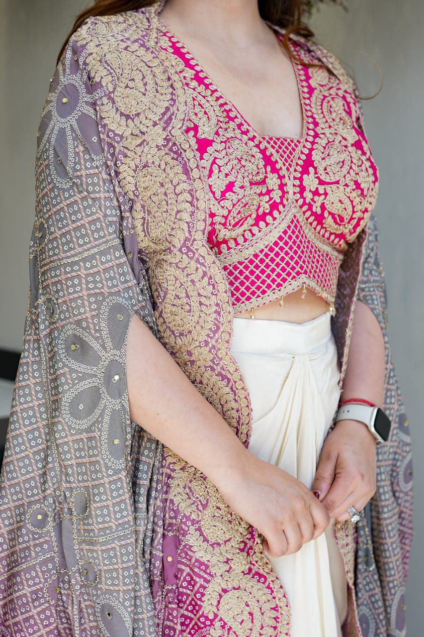 Bandhani print embroidered shrug styled with a ready-to-wear dhoti set
