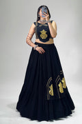 Black chaniya choli with golden Kalash patch work and 6-meter flared lehenga