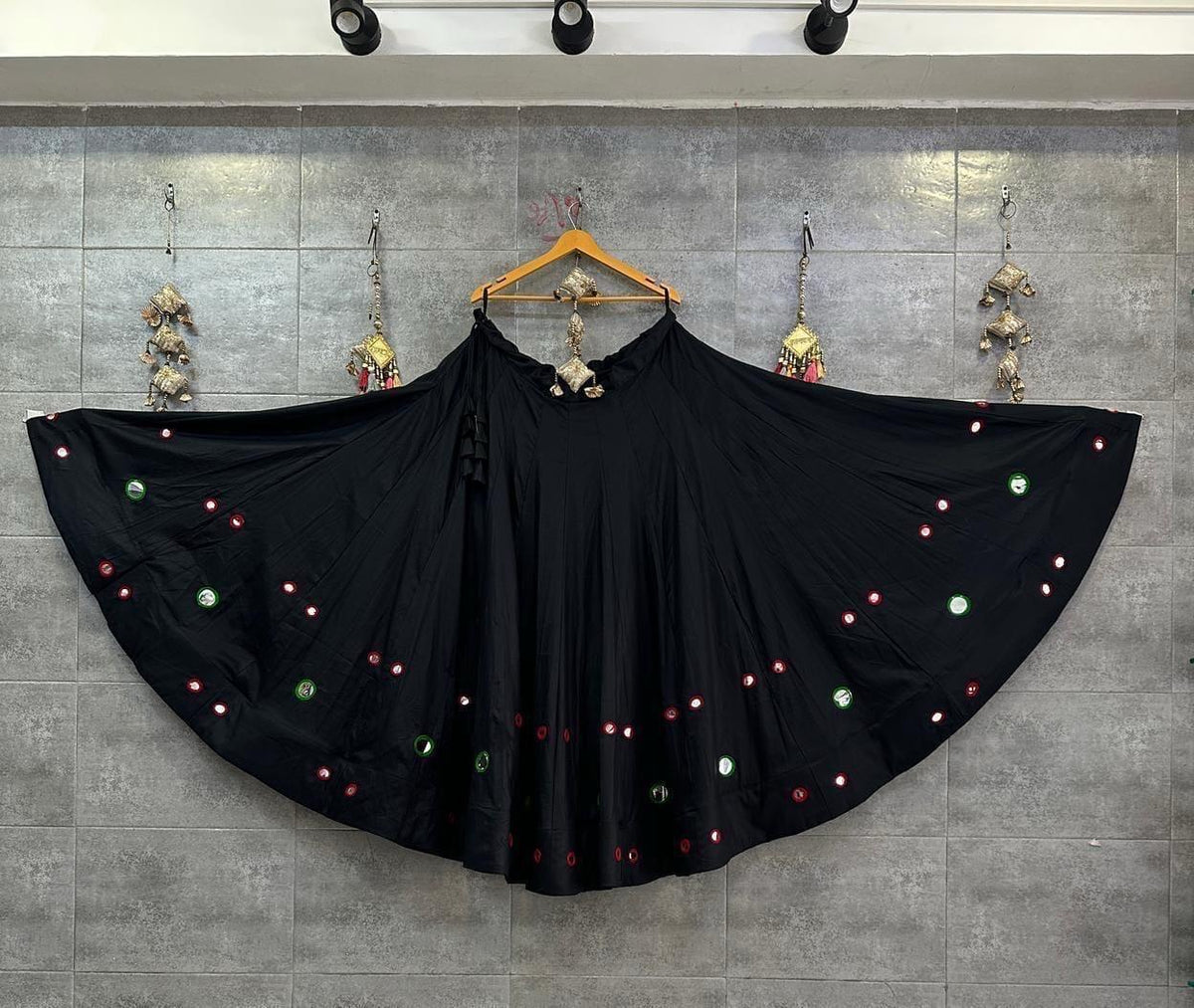 Black Chaniya Choli set with colourful mirror-style embellishments and festive design