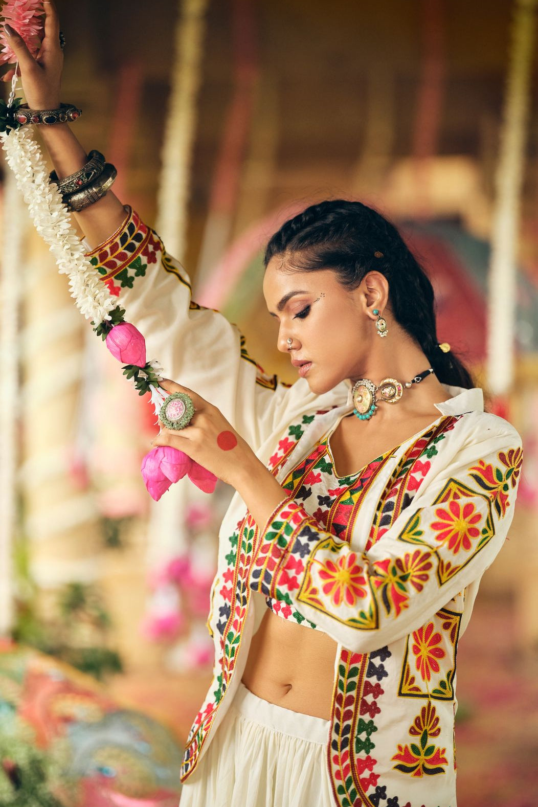 Woman wearing a pure cotton lehenga choli with embroidered koti and colorful detailing