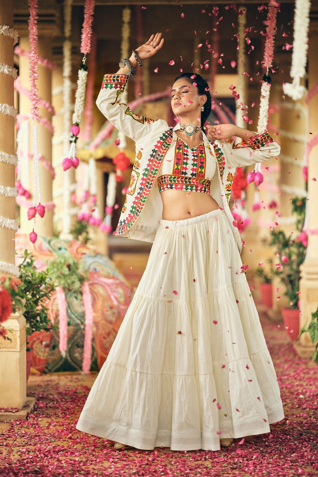 Woman dancing in a pure cotton lehenga choli with embroidered blouse and colorful koti