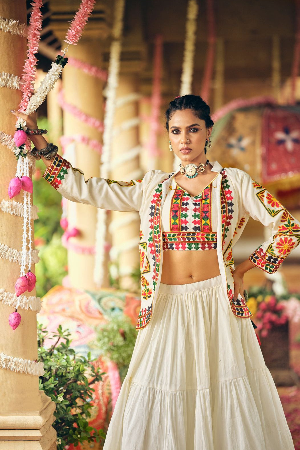 Cotton lehenga choli styled with an embroidered koti for a traditional festive look