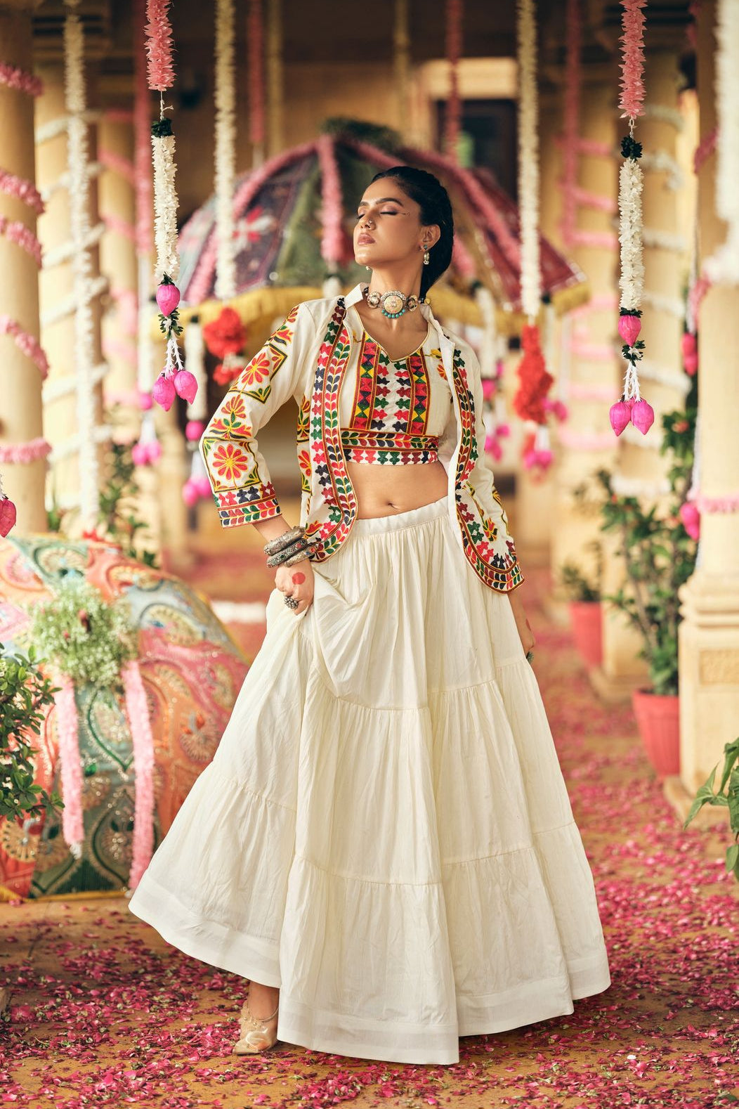 Full-length embroidered koti and cotton lehenga choli set styled for festive celebrations