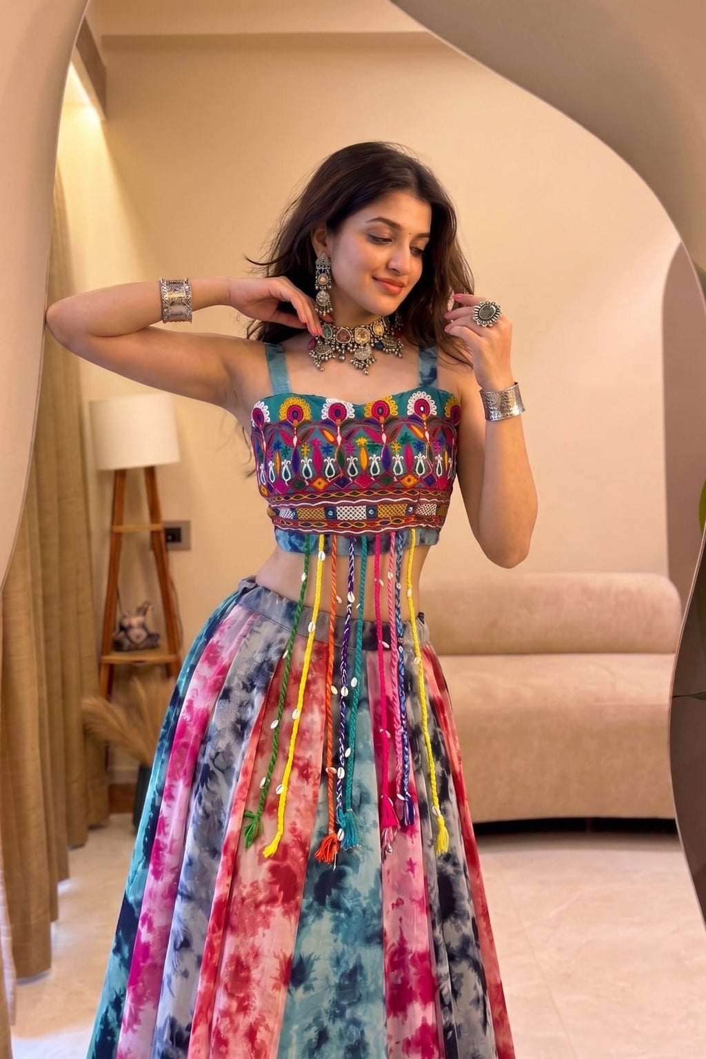 Detailed view of Gamthi work top paired with a colorful Shibori print lehenga