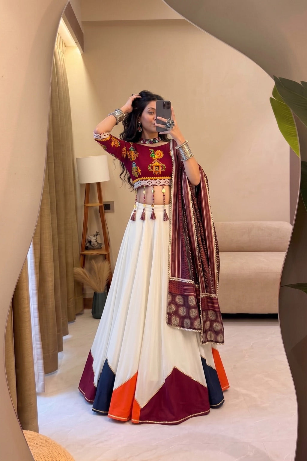 Traditional Garba chaniya choli with vibrant maroon blouse and flowing white lehenga