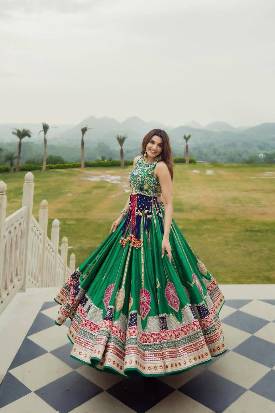 Green Indian lehenga choli with colourful digital print and flowing 4 meter flair
