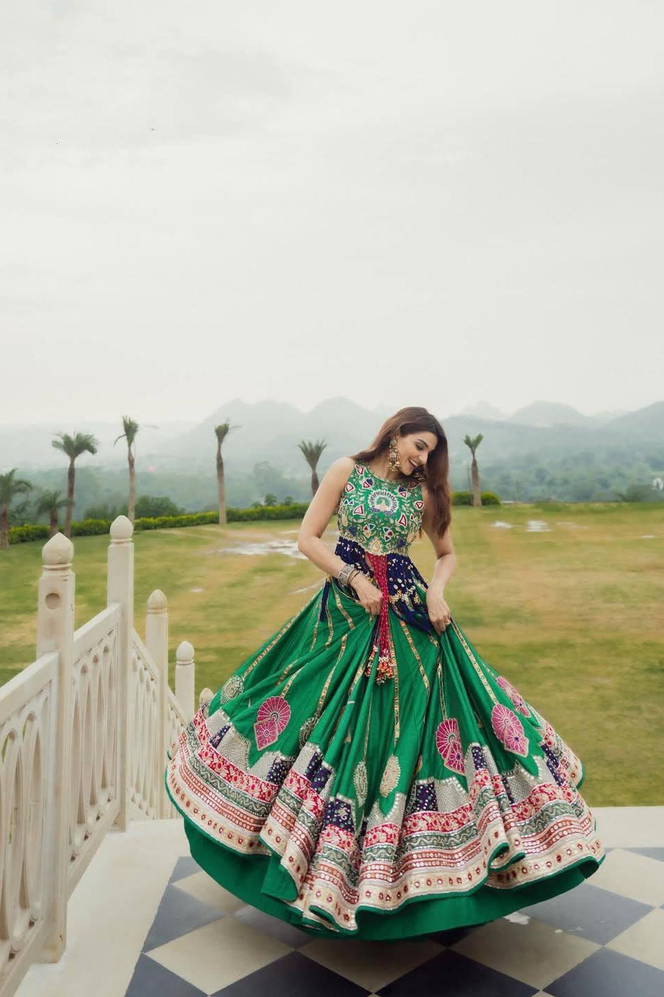 Green Indian lehenga with colourful digital print and flowing skirt flair