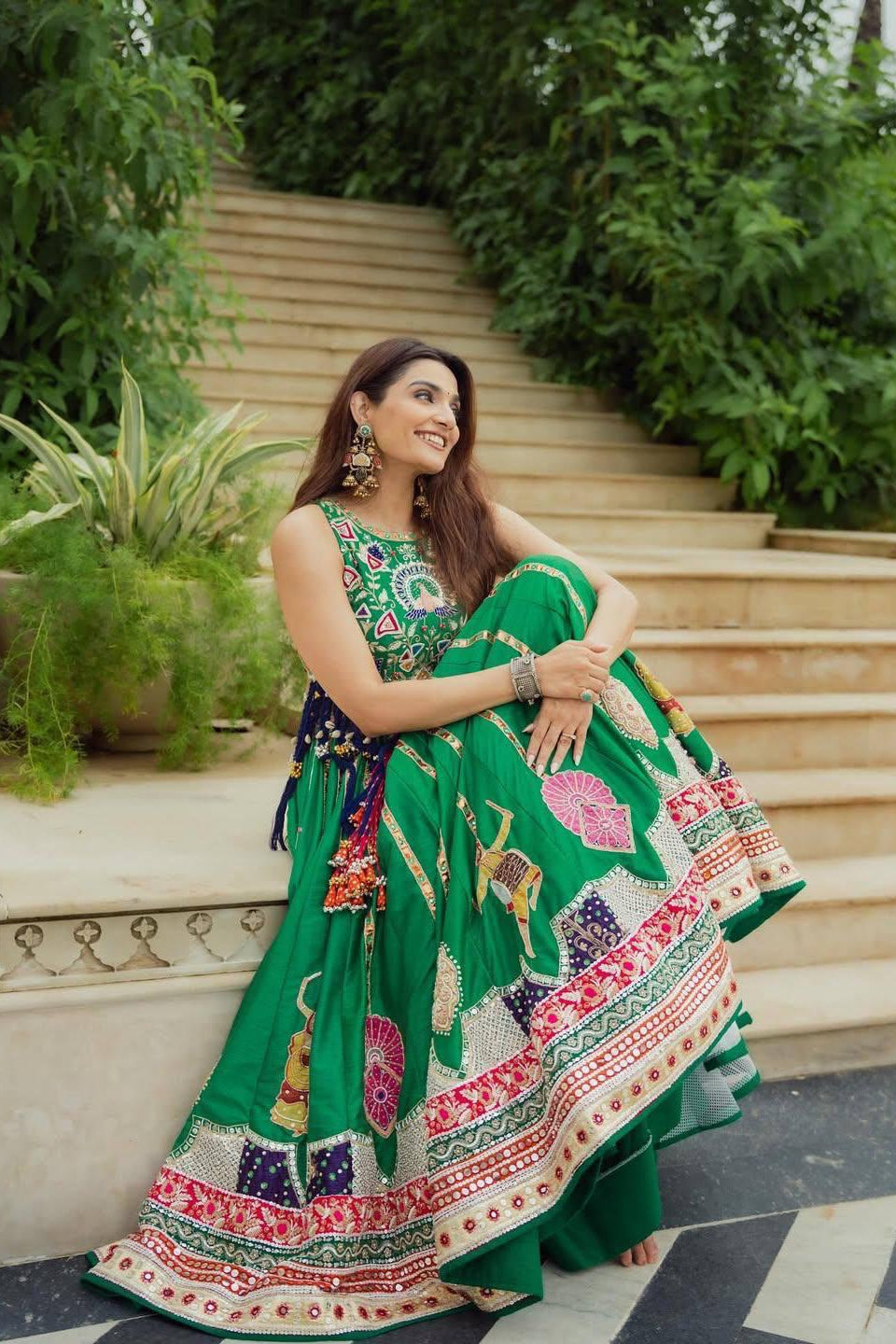 Full-length green Indian lehenga choli with printed border and 4 metre flair