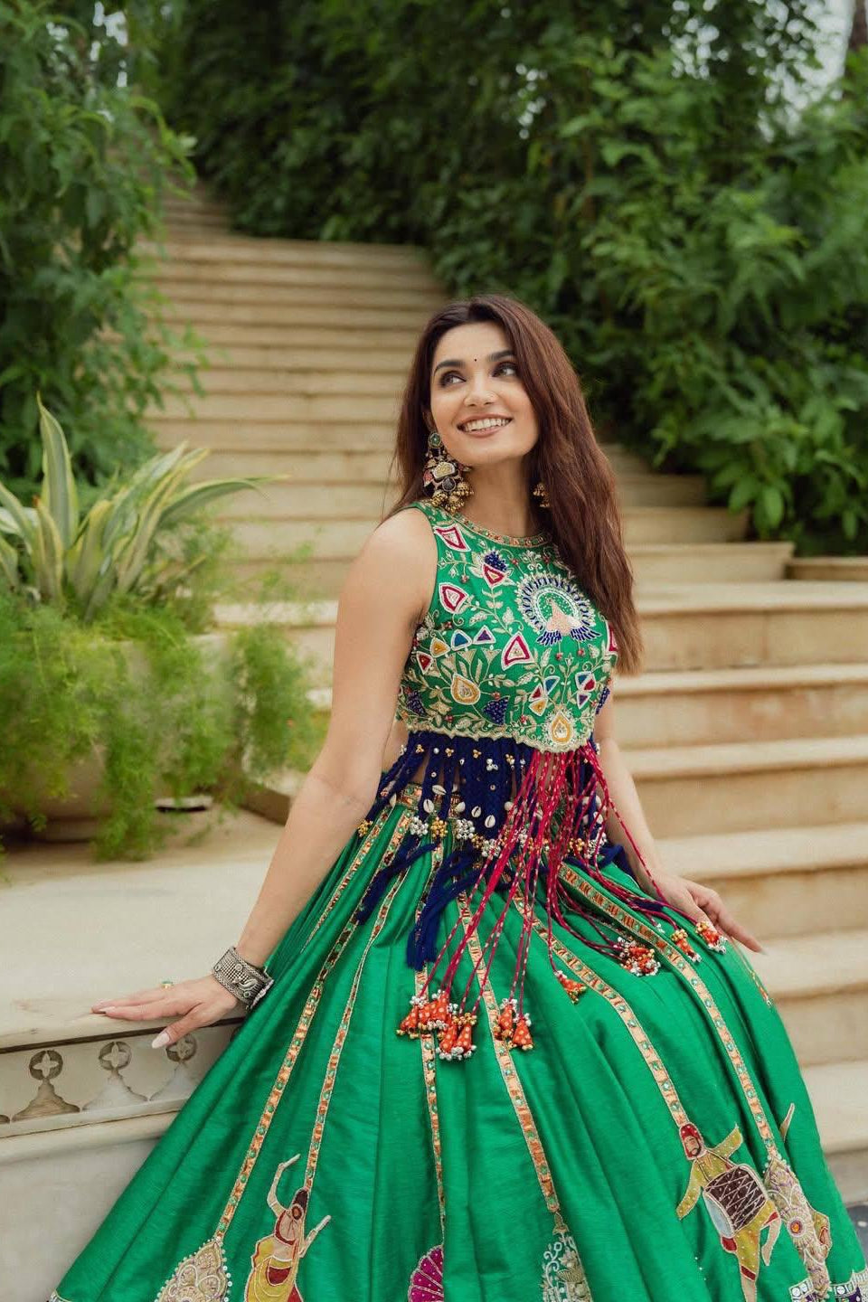 Green Maslin Cotton lehenga choli styled on heritage-inspired outdoor stairs