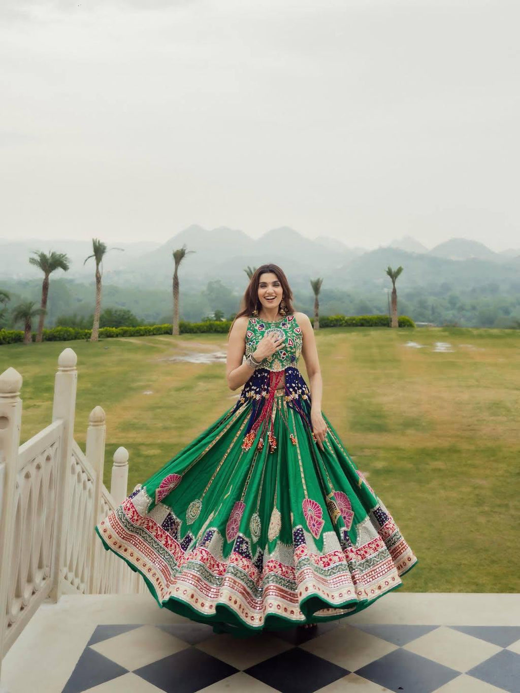 Green printed lehenga choli shown in a full front view with wide decorative border