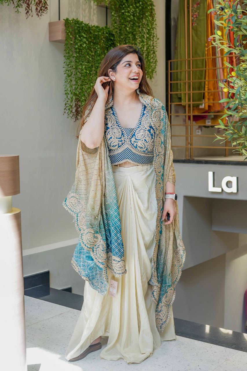 Indo Western dhoti set for women featuring an embroidered blue-teal blouse and printed shrug