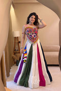 Women's Navratri lehenga with colorful Kutchi mirror-work blouse and flowing skirt
