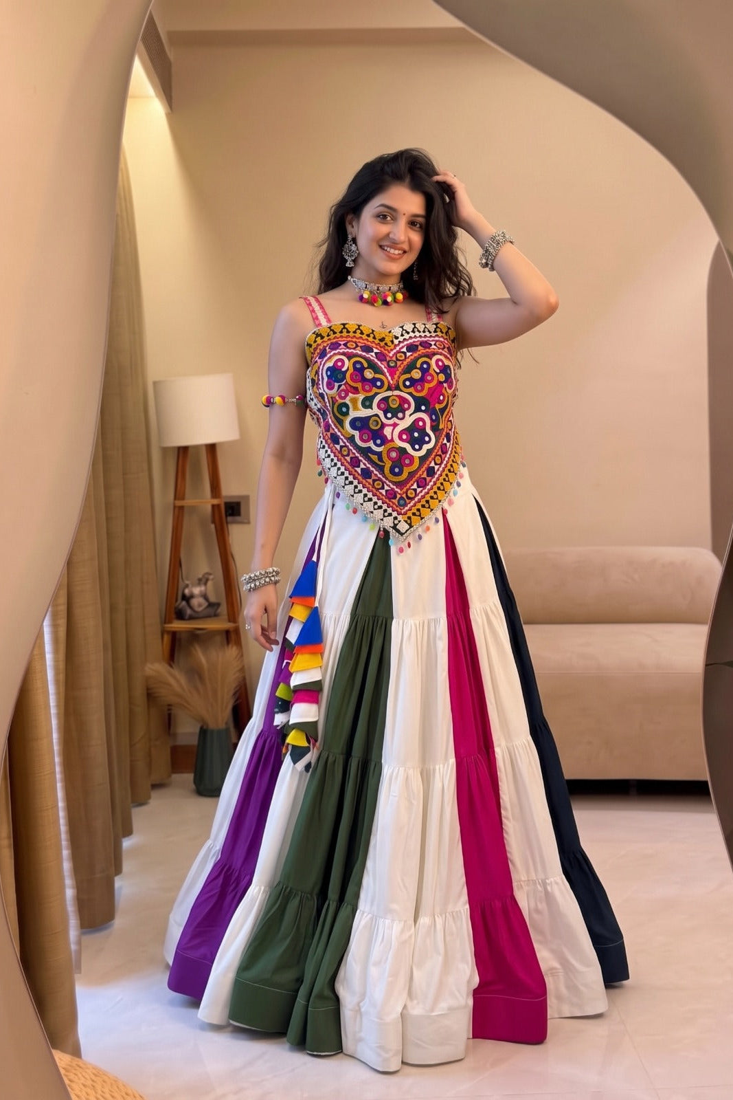 Women's Navratri lehenga with colorful Kutchi mirror-work blouse and flowing skirt