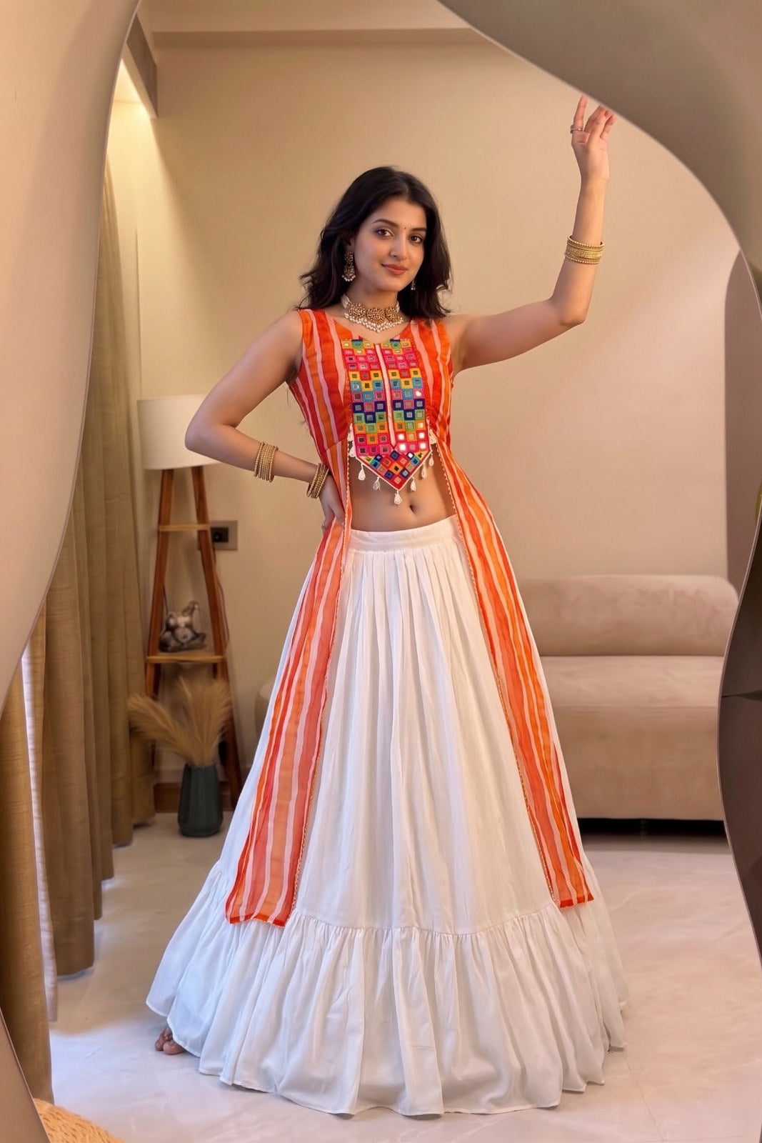 Leheriya lehenga set with white skirt and orange striped traditional top