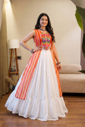 Traditional Leheriya lehenga with flowing white skirt and embellished top