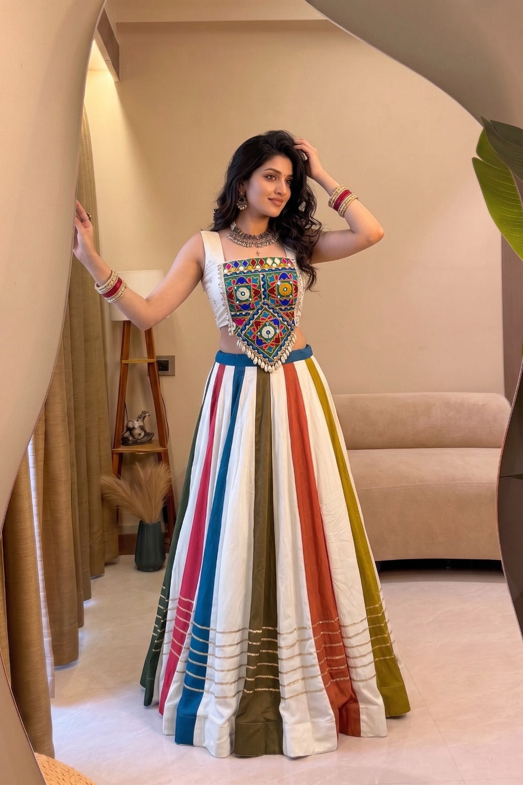 Front view of a multicolor lehenga choli with traditional Gamthi mirror work and Gota Patti detailing