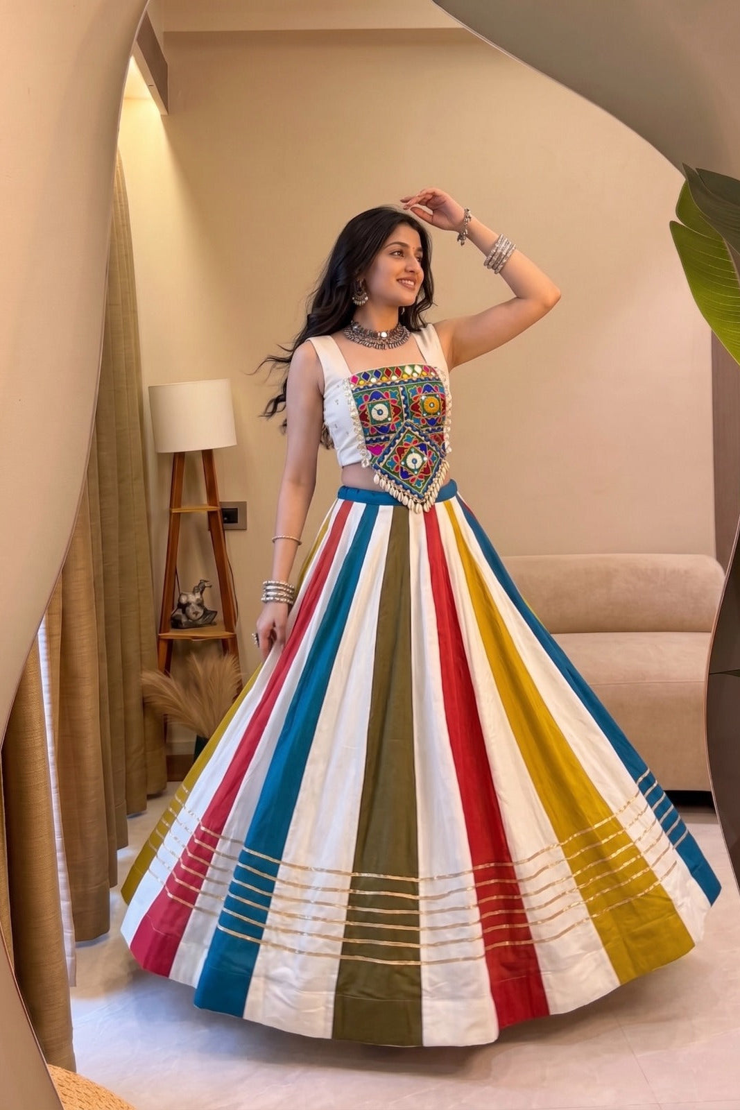Multicolor lehenga choli twirl showcasing the wide 8 meter flair and Gota Patti lace detailing