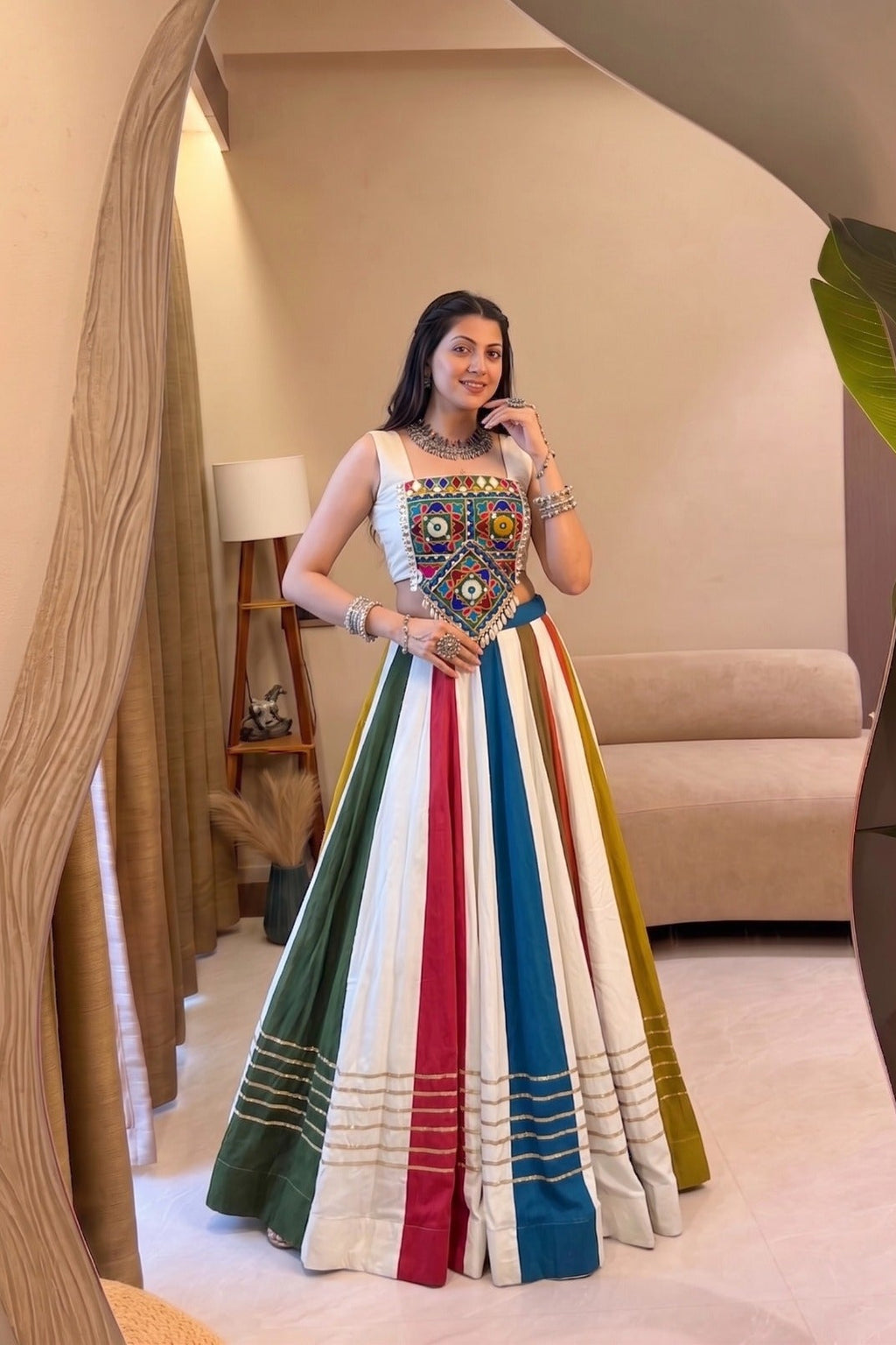 Multicolor Navratri lehenga choli featuring traditional mirror work and colorful vertical skirt panels