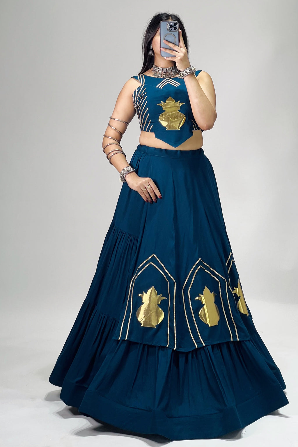 Teal blue Garba Chaniya Choli featuring golden Kalash detailing and fully stitched lehenga