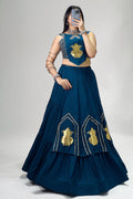 Teal blue Garba Chaniya Choli featuring golden Kalash detailing and fully stitched lehenga