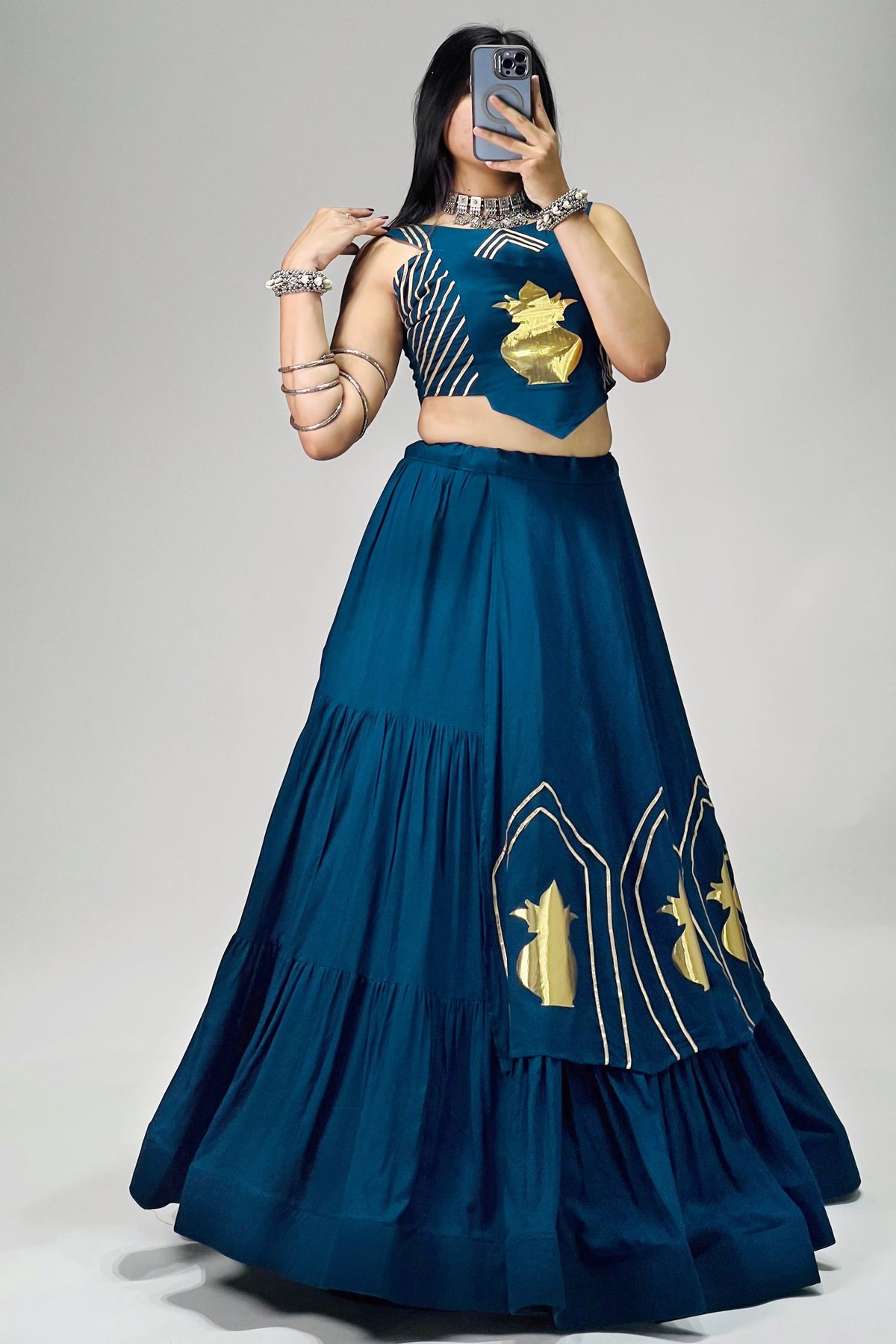 Teal blue Navratri Chaniya Choli with golden Kalash patch work and 6 meter flair