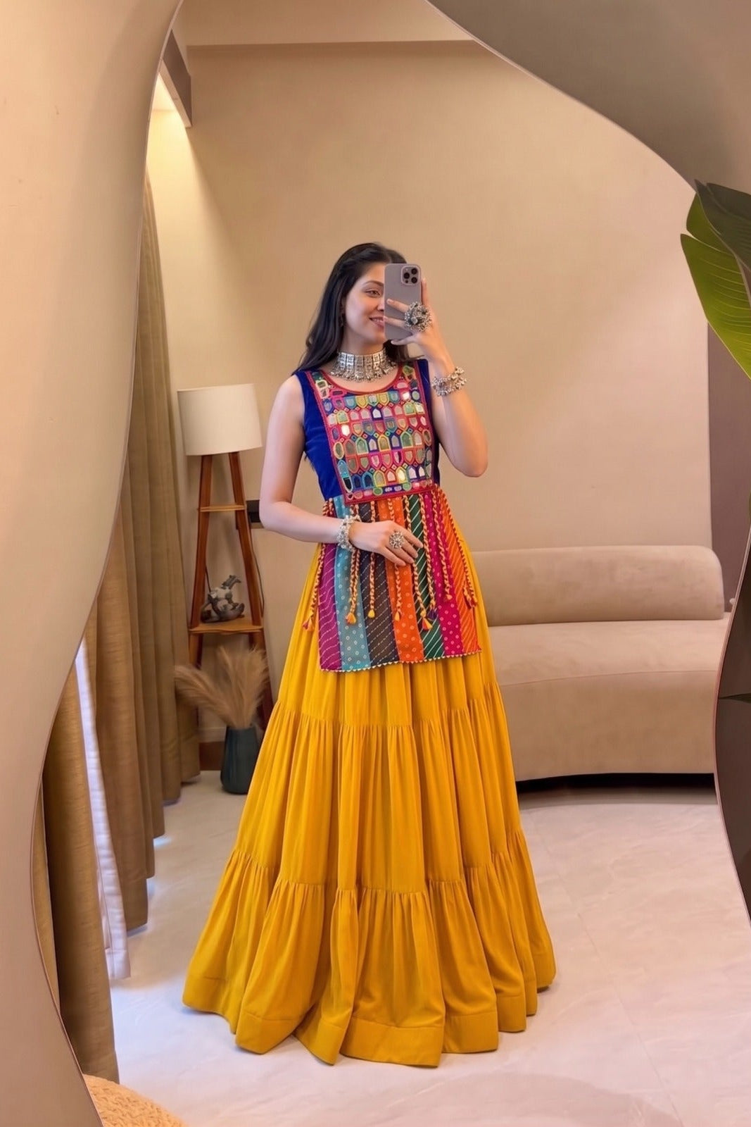 Mirror selfie featuring a yellow Navratri Chaniya Choli with colorful blouse