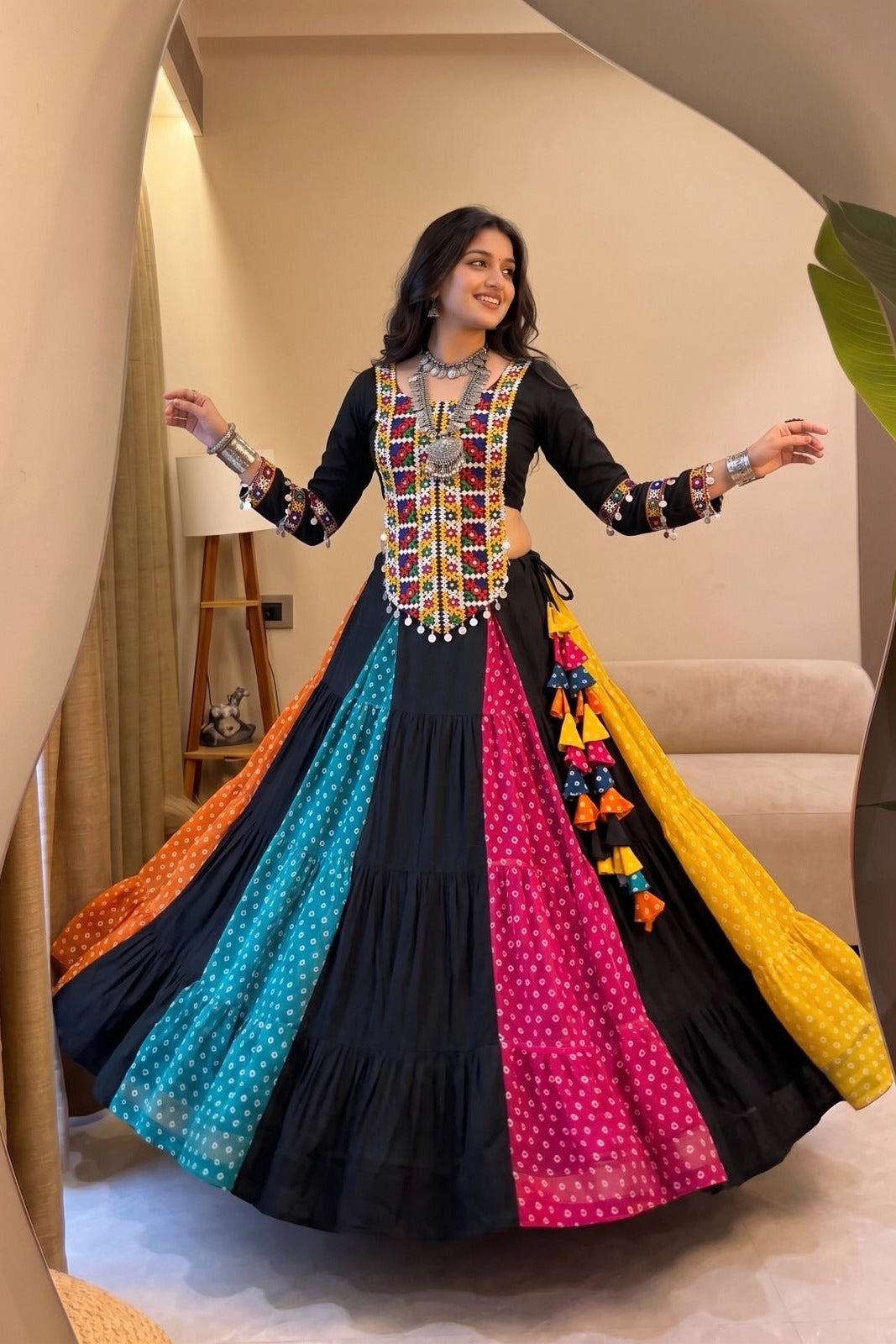 Black Navratri lehenga choli with colorful Kutchhi mirror work and Bandhani panels
