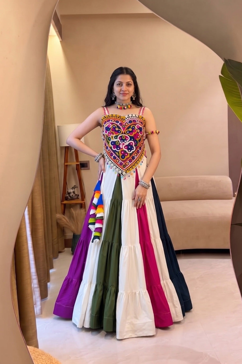 Multicolor Navratri lehenga choli with Kutchi mirror work and 8-meter flair