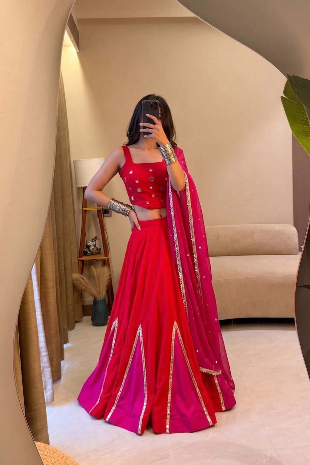 Red and pink Navratri lehenga choli with mirror work and georgette dupatta