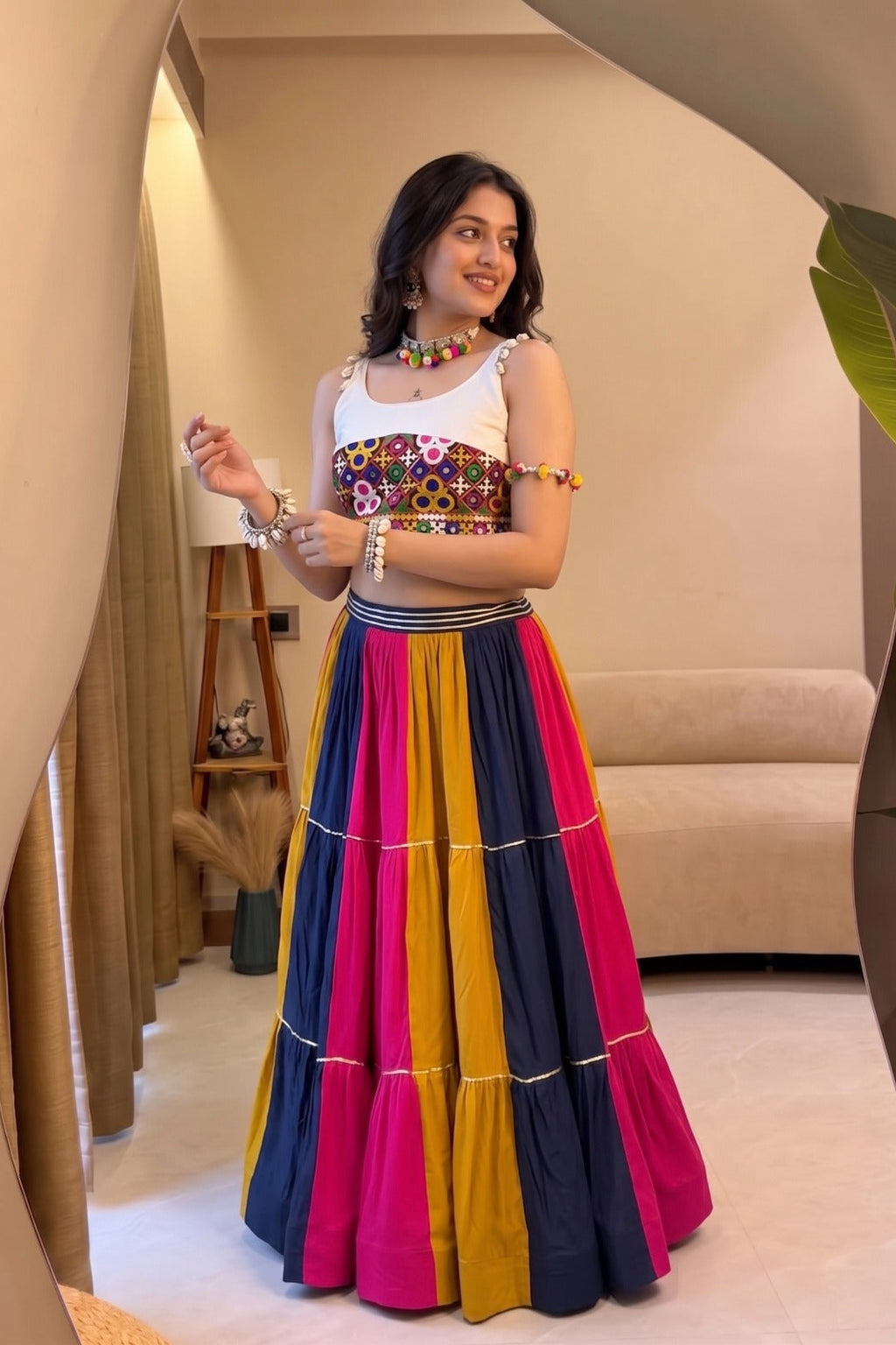 Multicolor Navratri lehenga choli with Gamthi work top and flared skirt