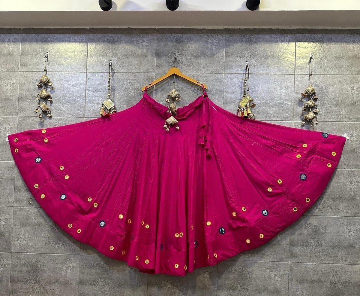Bright pink Indian Chaniya Choli with decorative detailing and matching festive styling
