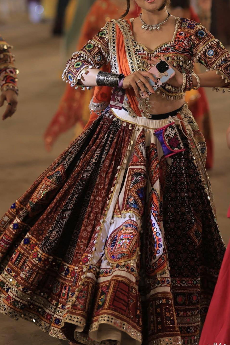 Indian printed mirror work lehenga choli with detailed choli and flowing festive skirt