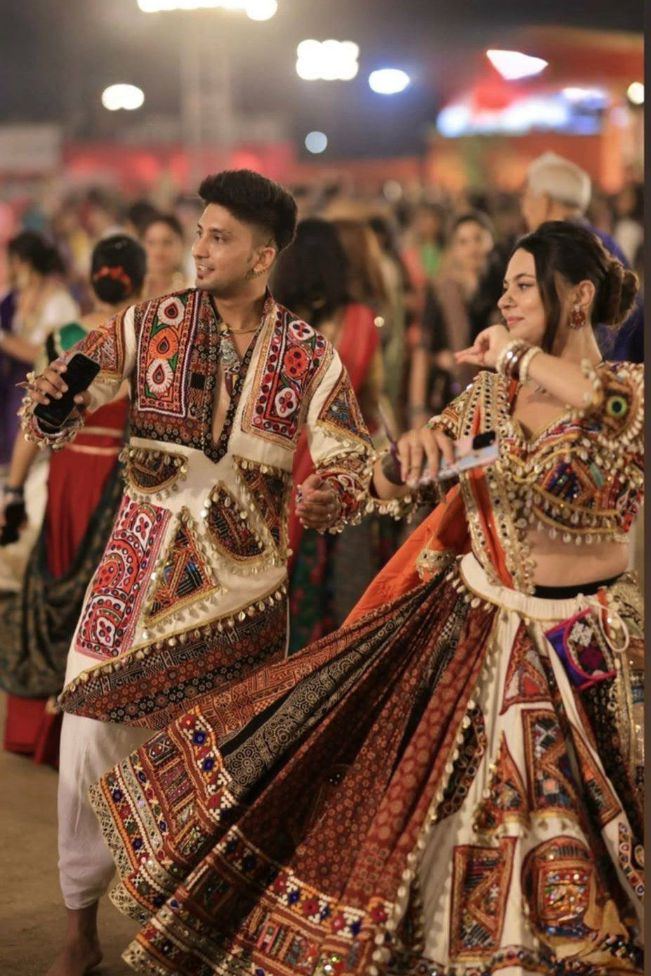 Printed mirror work lehenga choli styled for a traditional Garba and festive celebration look