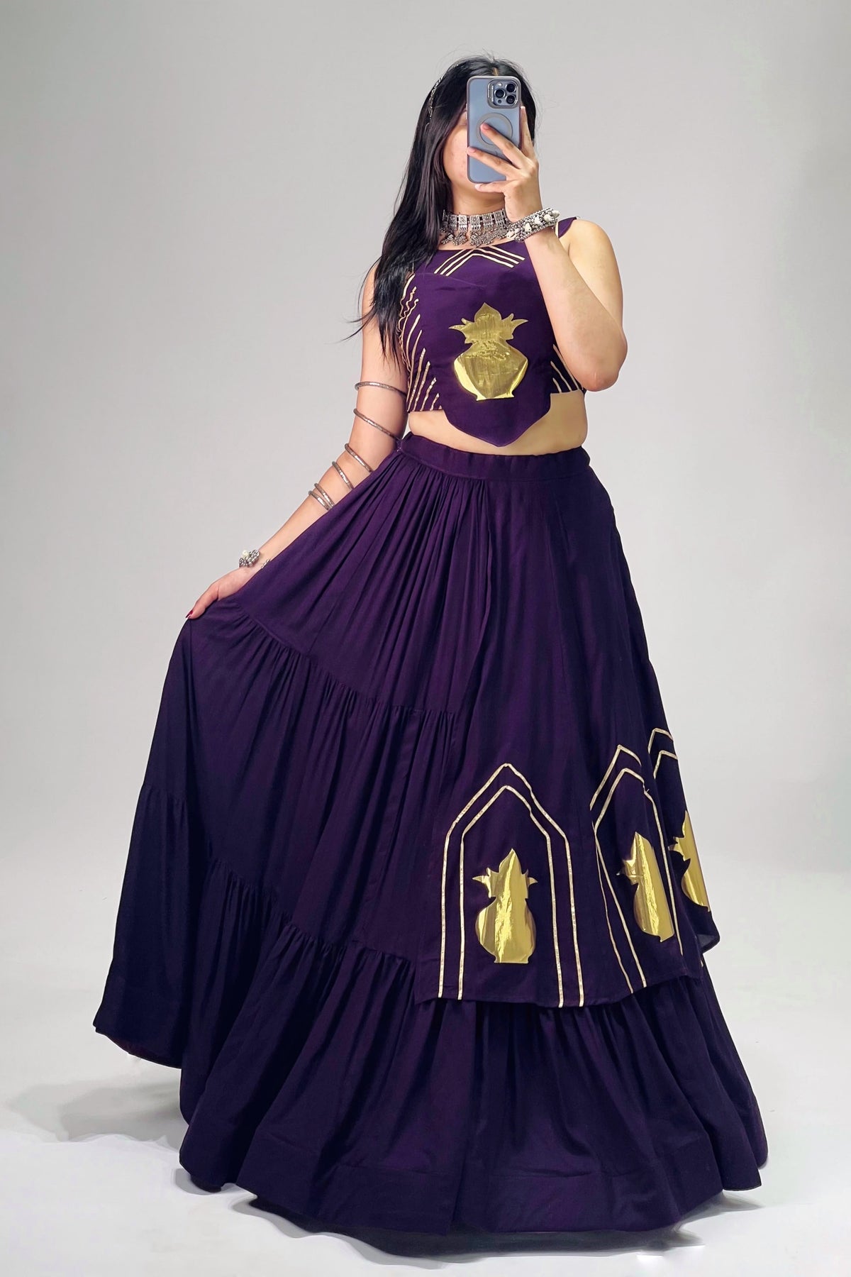 Purple chaniya choli featuring golden Kalash motifs and Gota Patti detailing