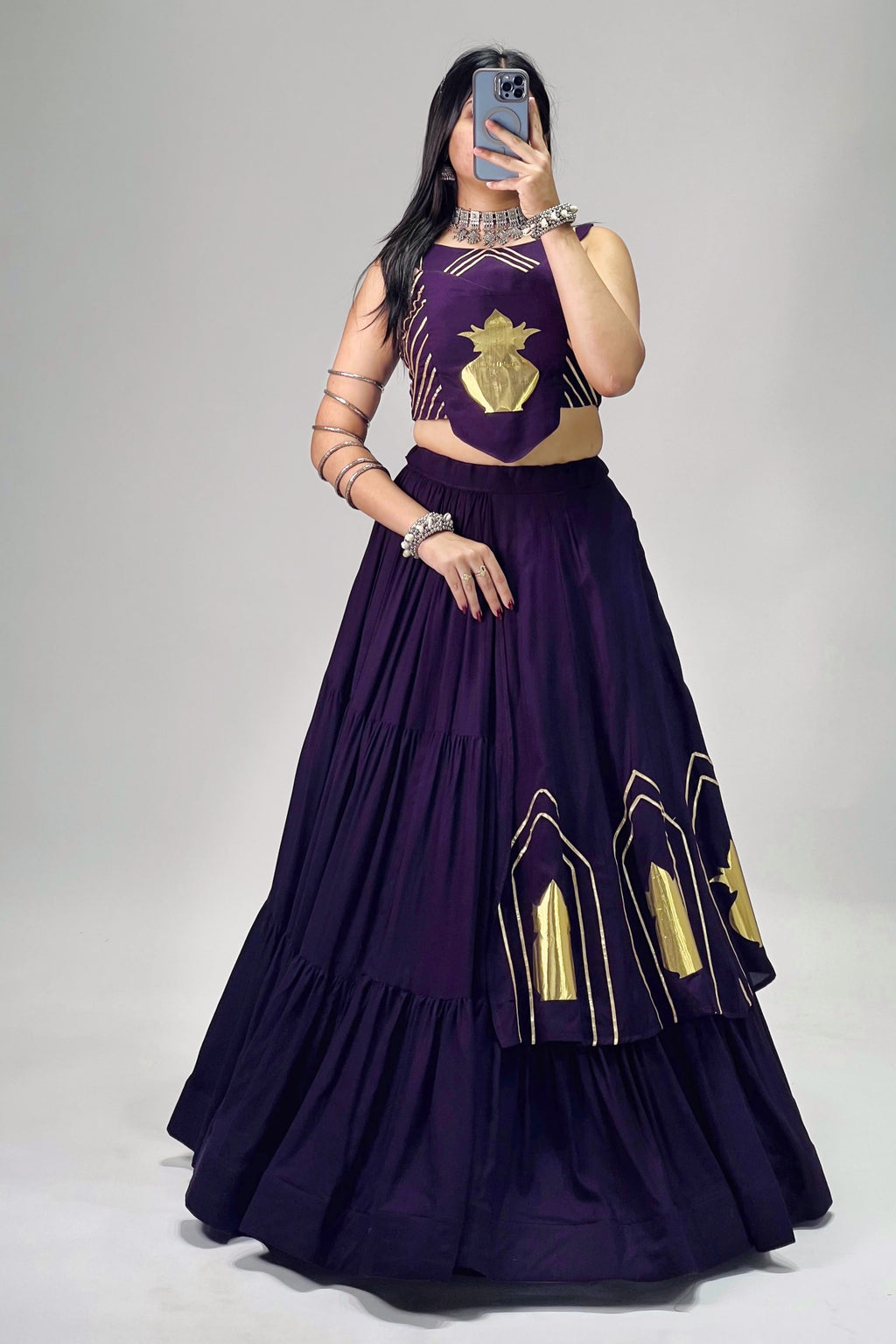 Purple Navratri chaniya choli with golden Kalash patch work and 6-meter flair