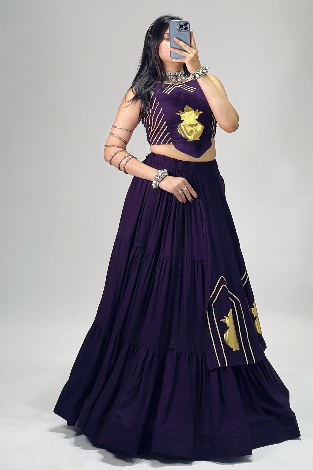 Purple Navratri lehenga set back view showing choli dori closure