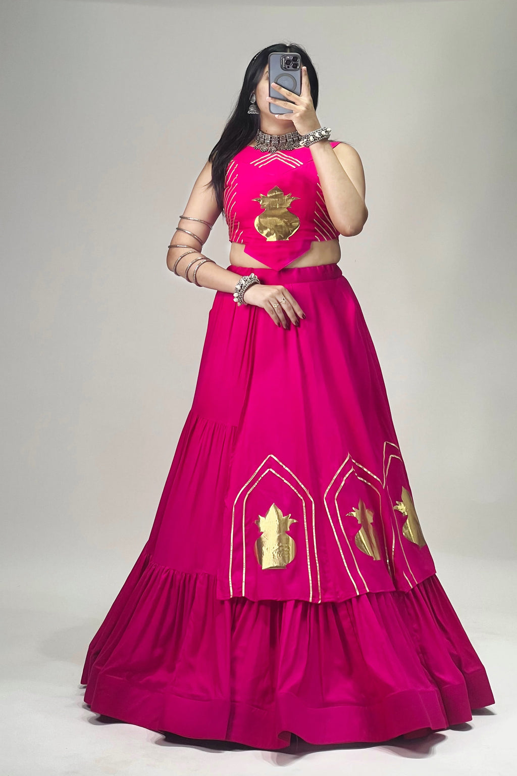 Front view of Rani pink rayon cotton chaniya choli with Gota Patti details and 6 meter lehenga flair