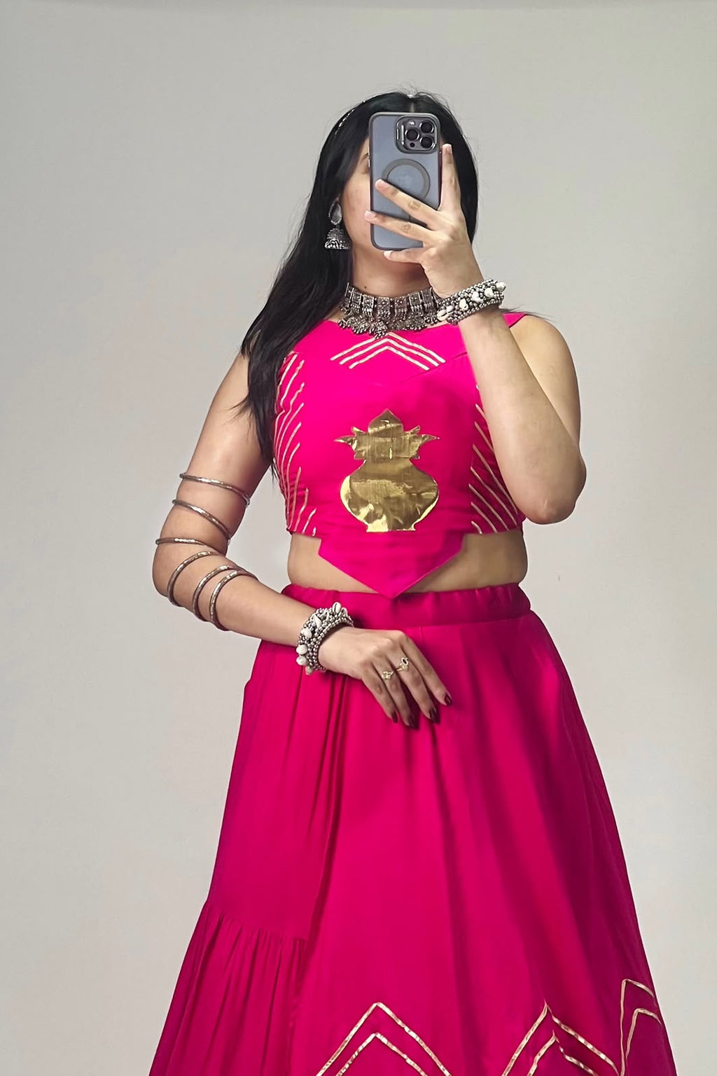 Close view of Rani pink chaniya choli blouse featuring golden Kalash patch and decorative Gota Patti work