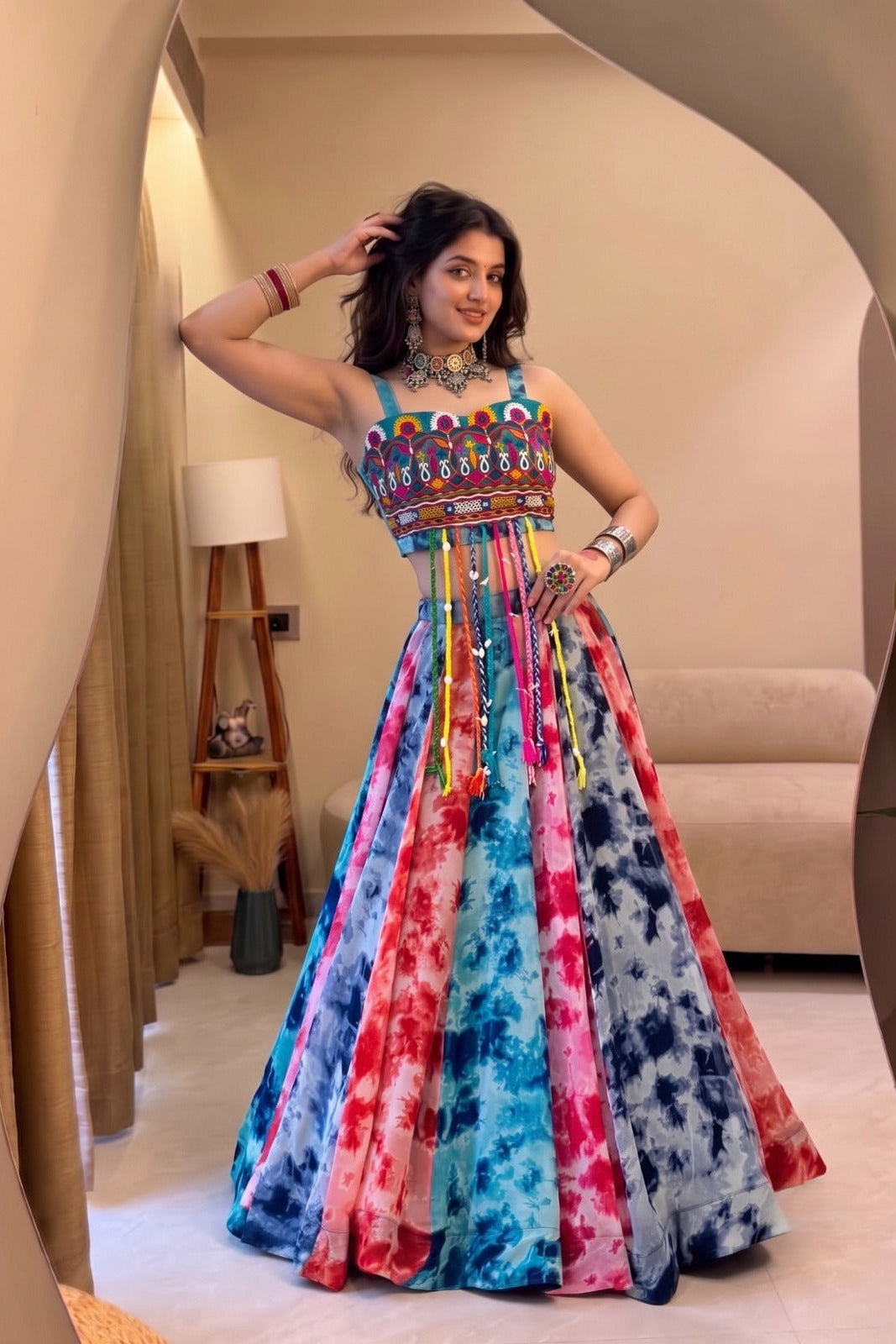 Multicolor Shibori print lehenga with fancy Gamthi work top in a full-length festive look