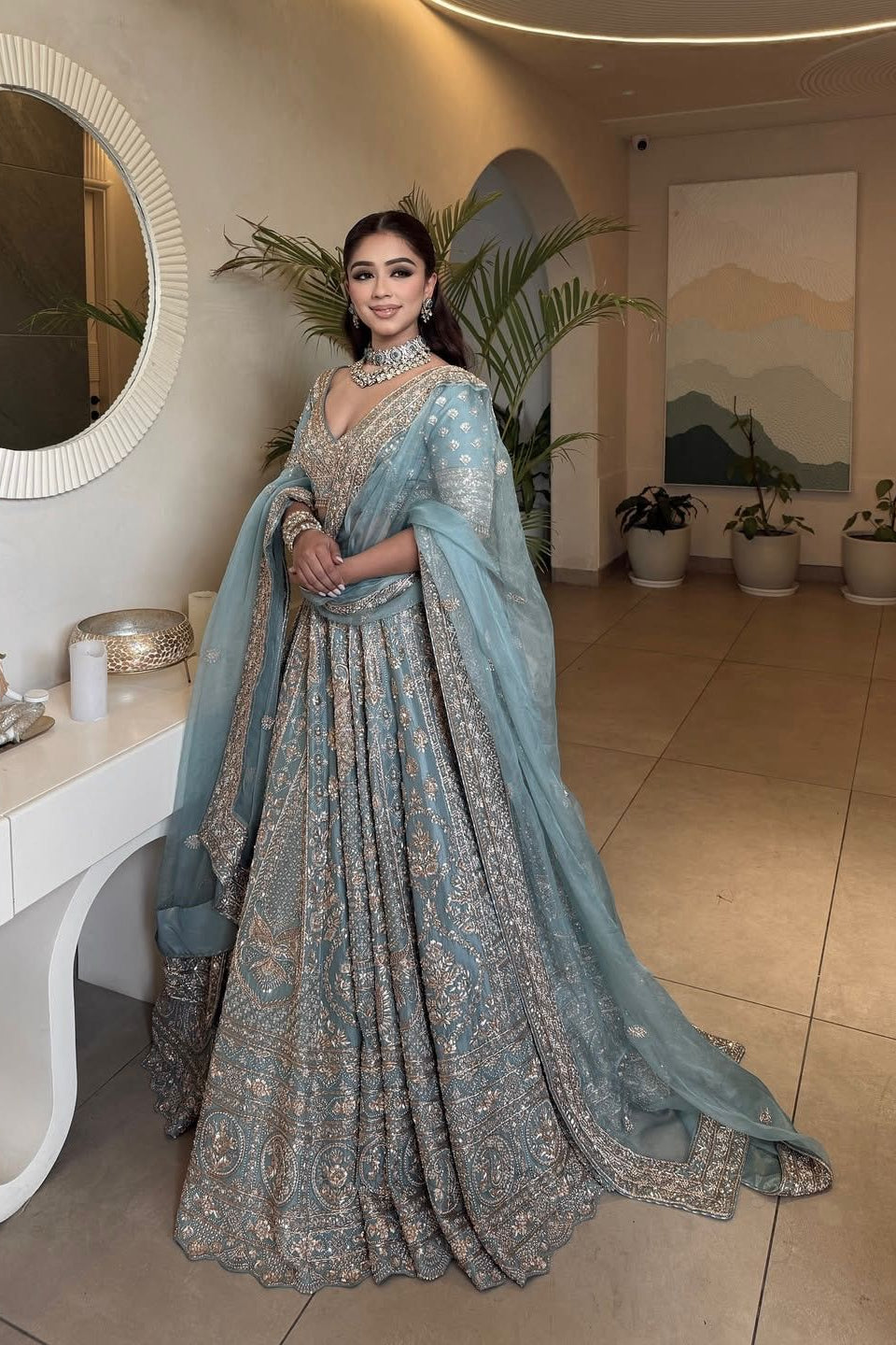 Slate blue Indian lehenga with matching glass silk dupatta and embellished blouse