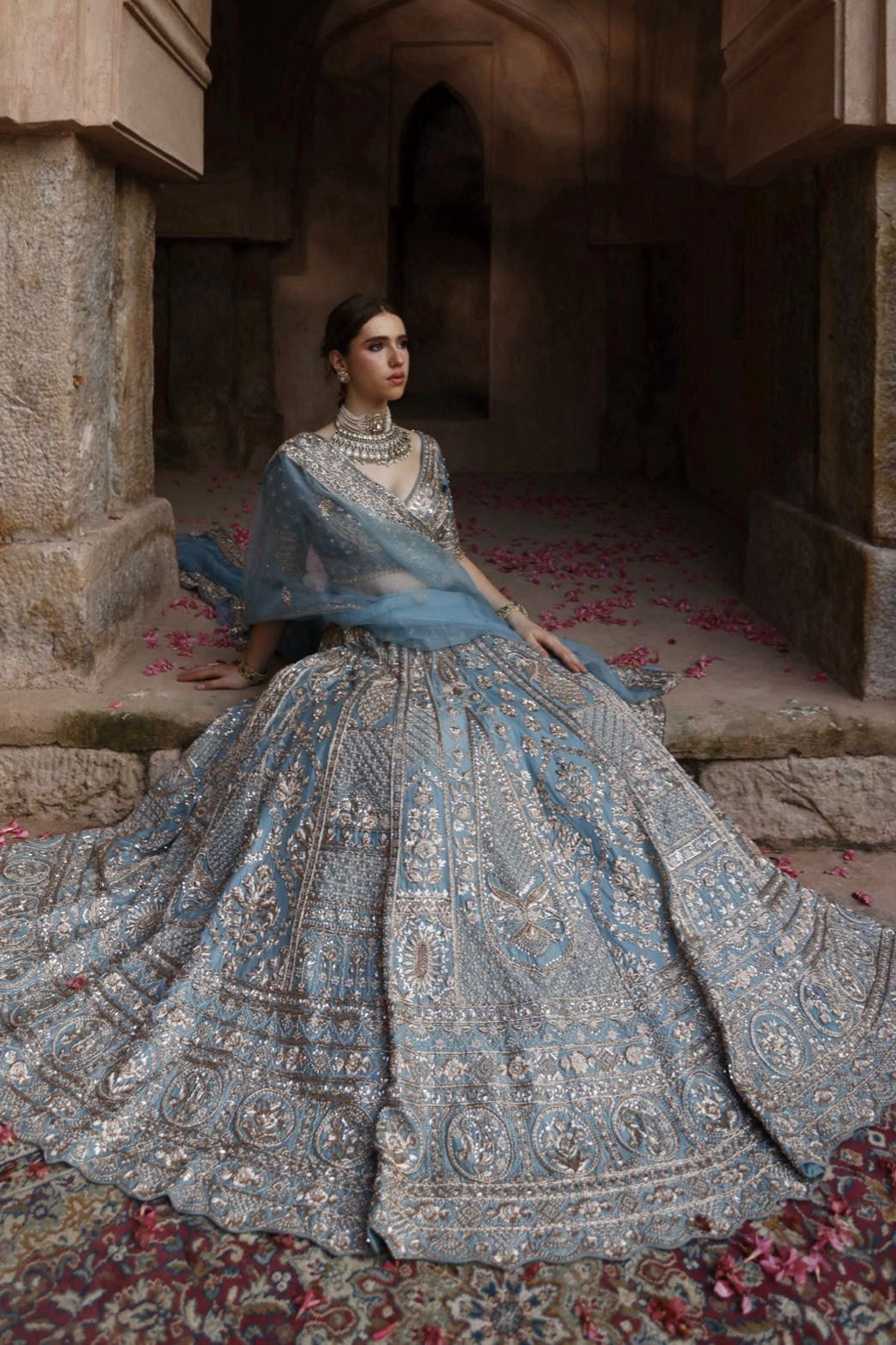 Slate blue lehenga choli showcasing detailed sequin and zari embellishment