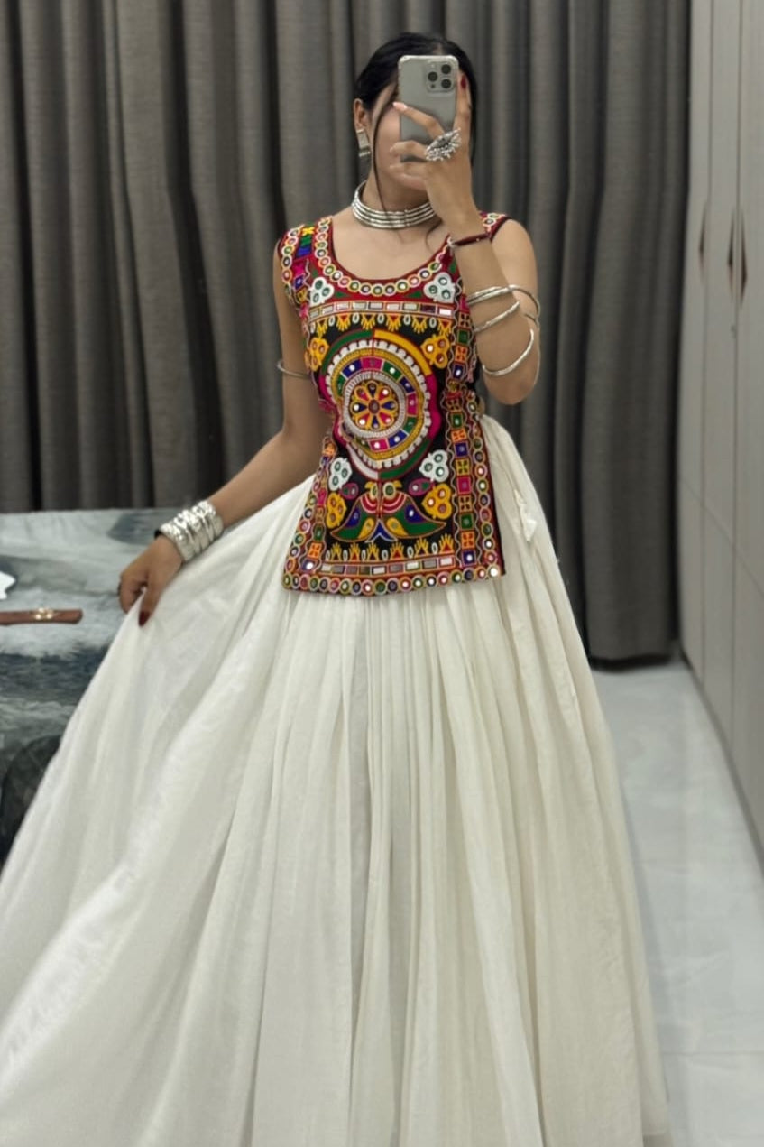 White Kediya Chaniya Choli outfit shown with a full flared chaniya and colorful traditional embroidery
