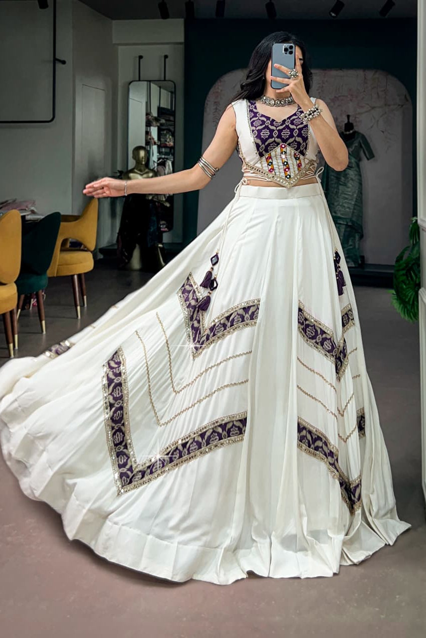 White Navratri lehenga with six-meter flair and purple printed decorative panels