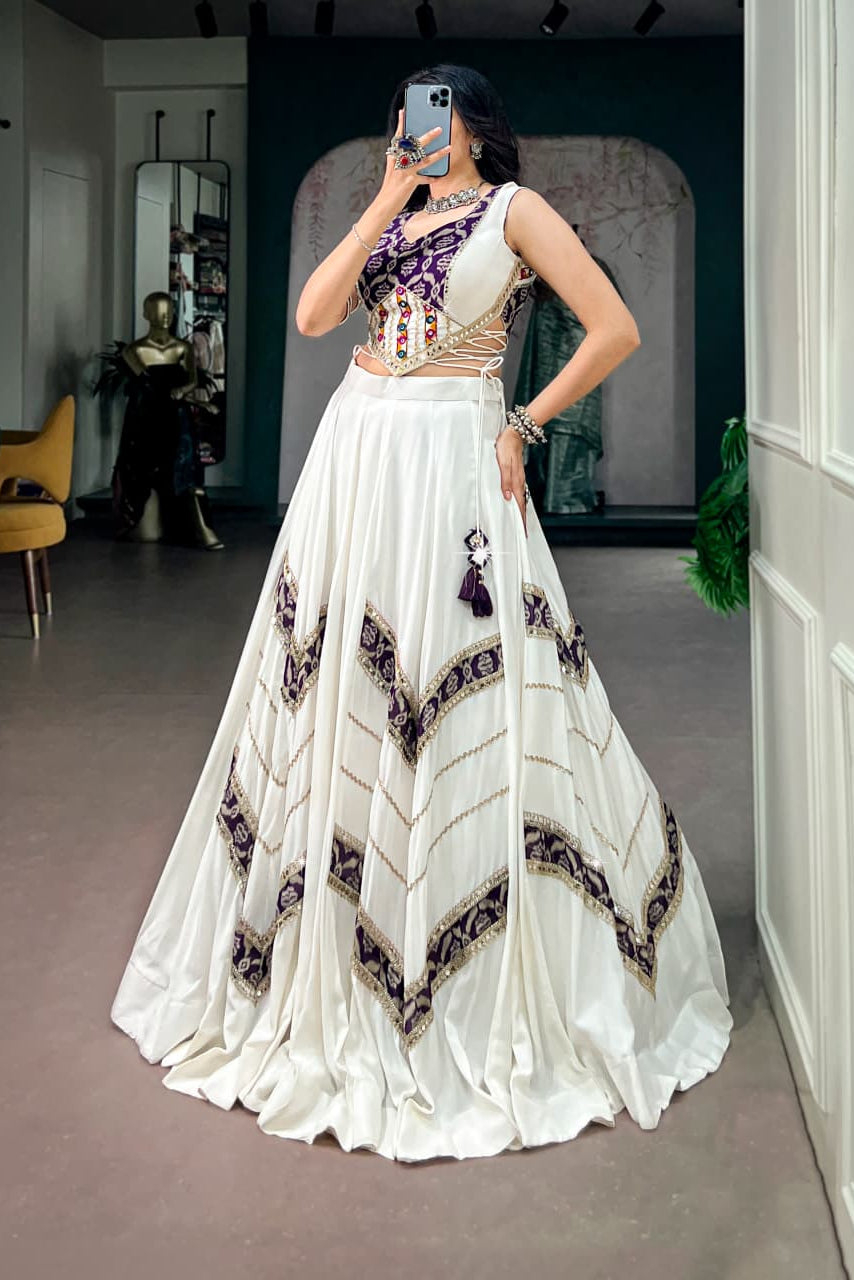 White and purple Garba lehenga choli with flowing silhouette and traditional printed details