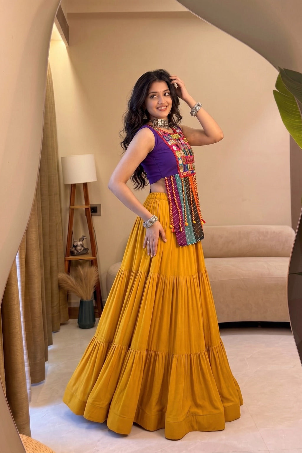 Side view of yellow Chaniya Choli with colorful Bandhani mirror work blouse